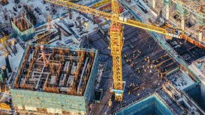 Sky-view of a construction site with a large crane