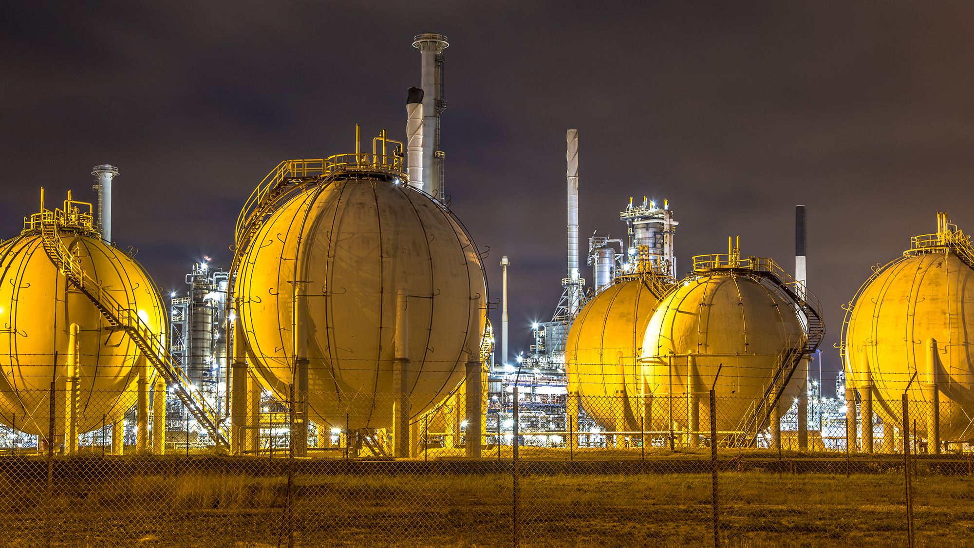 natural gas tanks at night